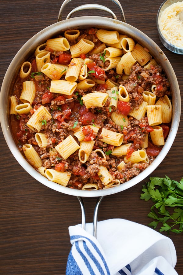 Easy Weeknight Dinner Recipes. Overhead photo of large pasta mixed with ground beef and tomatoes.