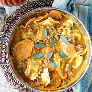 Easy Ravioli with Pumpkin Sausage Vodka Sauce is a proof positive that serving pumpkin for dinner is always a winner! - kudoskitchenbyrenee.com