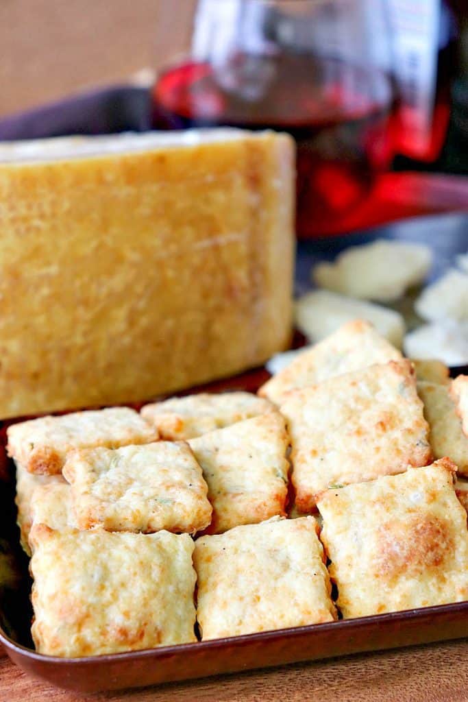 Vertical closeup image of Parmesan fennel crackers. Thanksgiving and fall appetizer recipe roundup.