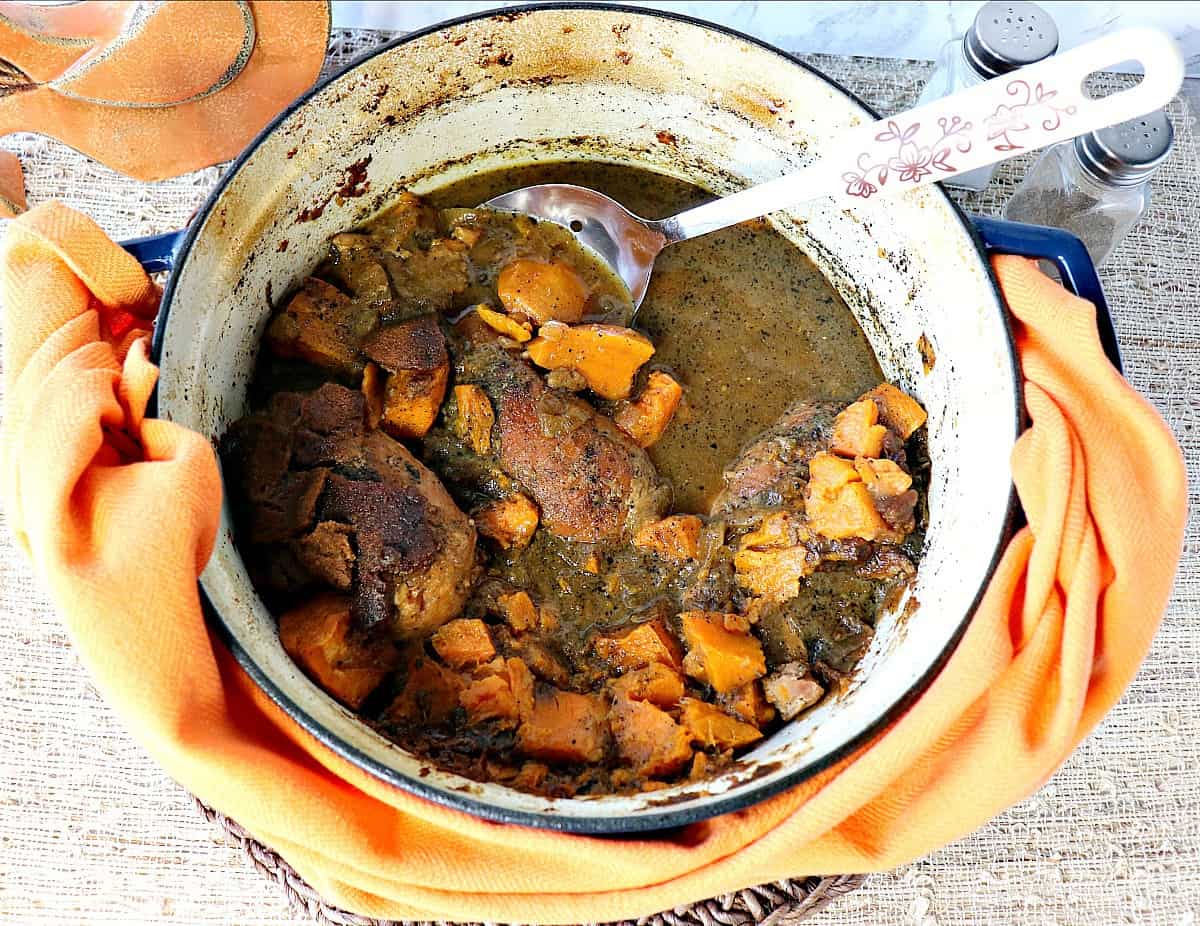 Worried that your chicken breasts are always dry and boring? No longer. These fork-tender Apple Cider Braised Chicken Breasts with Sweet Potatoes and Gingersnaps are anything but dry and boring! - kudoskitchenbyrenee.com A look into a Dutch oven containing braised chicken breast with sweet potatoes.