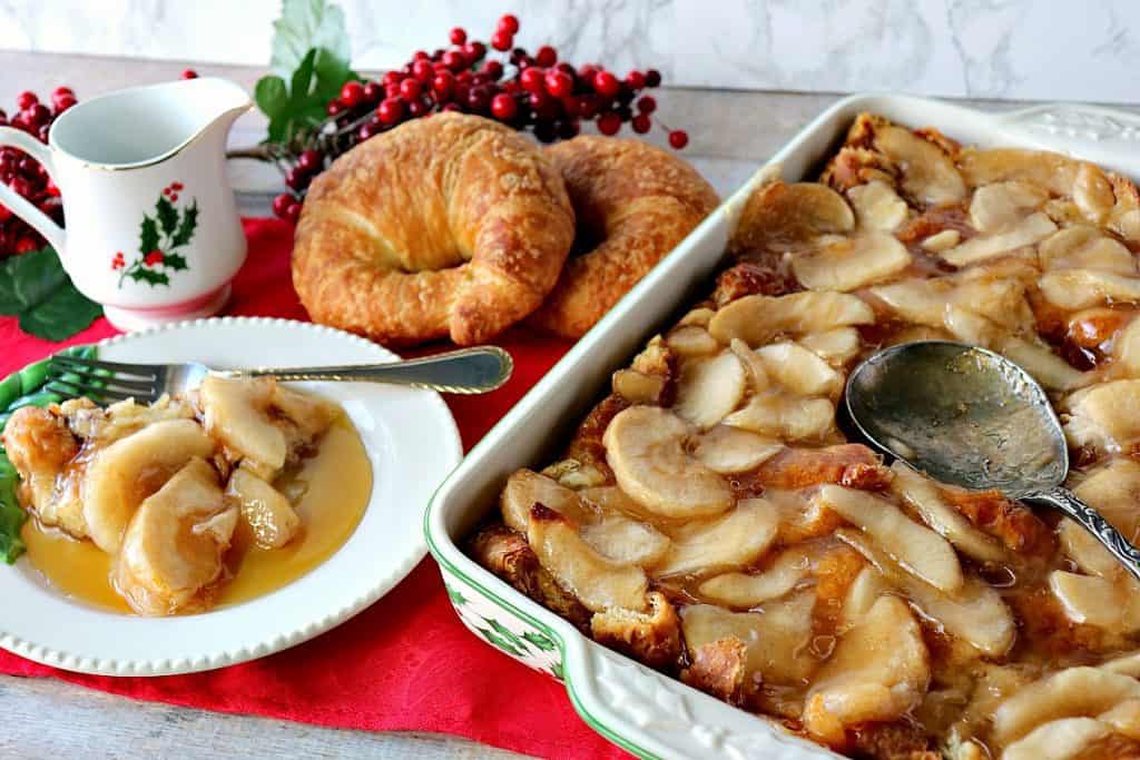 A horizontal photo of a casserole dish filled with apple croissant breakfast bake with a Christmas theme.