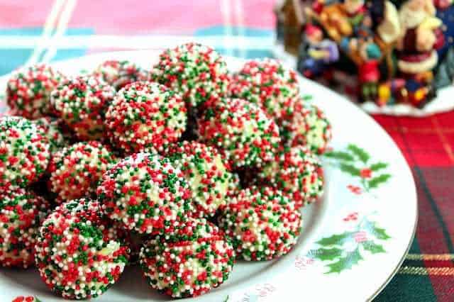 A plate of cream cheese Christmas sprinkle cookies for a Colossal Christmas Cookie Recipe Roundup.