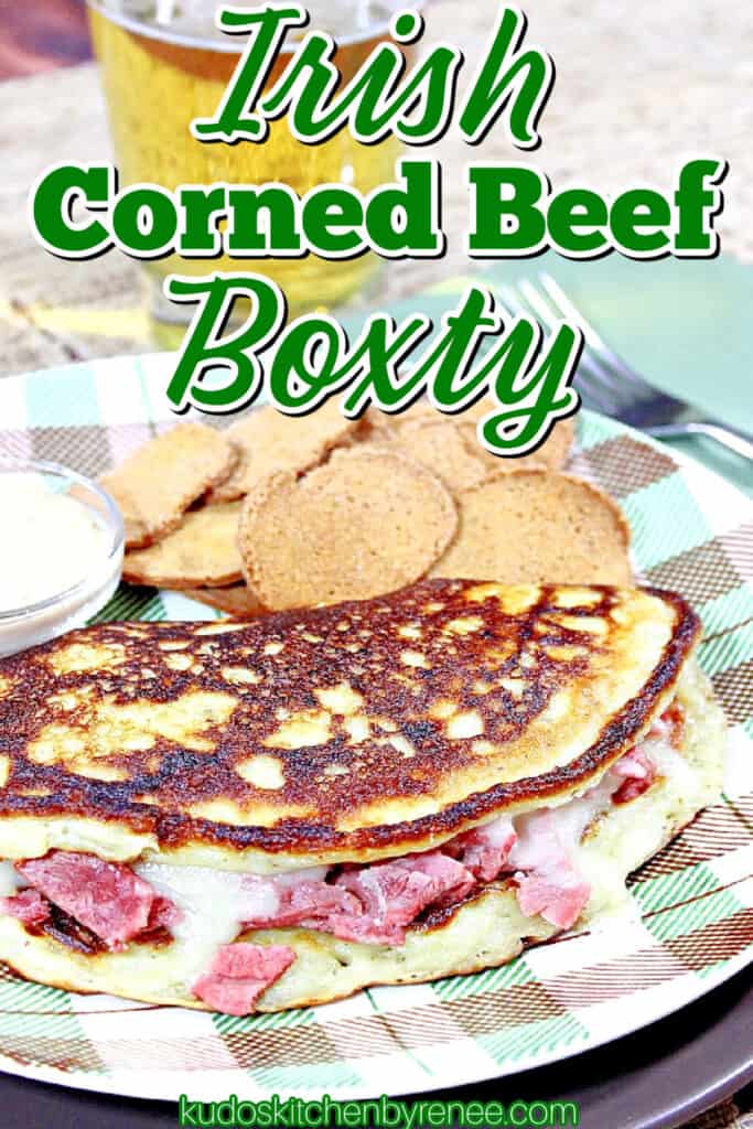 A closeup vertical title text image for Irish Corned Beef Boxty potato pancake with melted cheese and corned beef.
