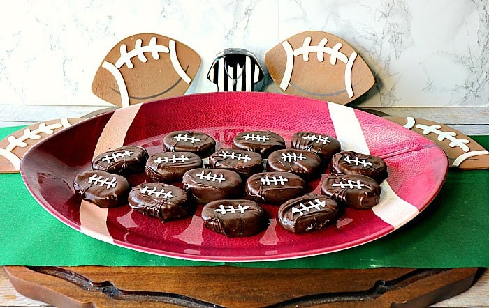 Peanut Butter and Jelly Chocolate Footballs on a football plate with a green napkin and a referee shirt.