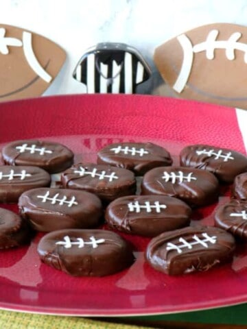 A football tray filled with Peanut Butter and Jelly Chocolate Footballs