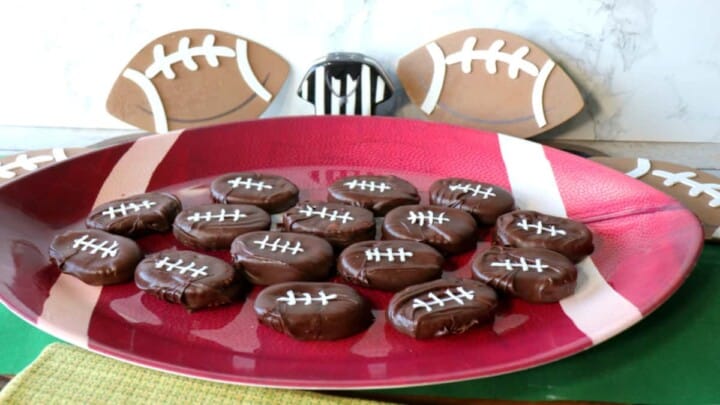 A football tray filled with Peanut Butter and Jelly Chocolate Footballs