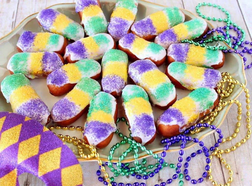 Purple Gold and Green Mini Long Johns on a platter with beads - kudoskitchenbyrenee.com