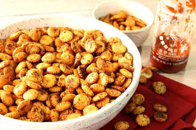 A bowl filled with Sriracha Firecracker Cracker Snackers 