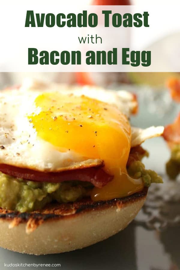 Closeup picture of a runny egg on top of avocado toast with bacon
