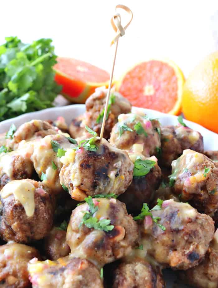 Turkey meatball with a cocktail pick and chopped fresh cilantro