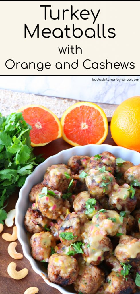 Vertical image of a plate of turkey meatballs with sauce and cilantro