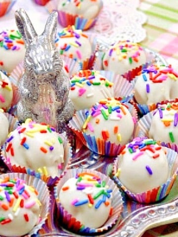 A cute bunny tray filled with No-Bake Shortbread Cookie Truffles with sprinkles.