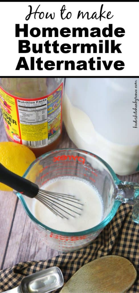A look at homemade buttermilk inside a measuring cup with a whisk with a lemon, vinegar, and a milk jug in the background.