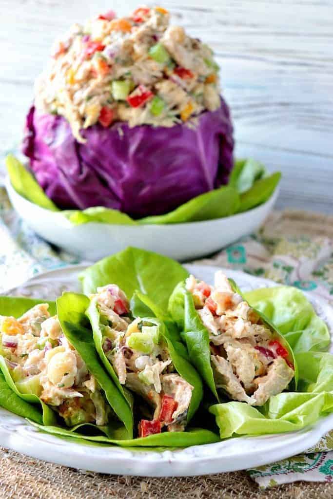 Chicken salad in lettuce cups and in a purple cabbage bowl.