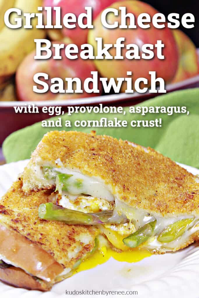 A vertical closeup image of a sliced in half Grilled Cheese Breakfast Sandwich along with a title text overlay graphic.