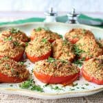 Plate of Italian Roasted Plum Tomatoes with breadcrumbs and cheese.