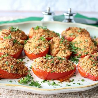 Plate of Italian Roasted Plum Tomatoes with breadcrumbs and cheese.