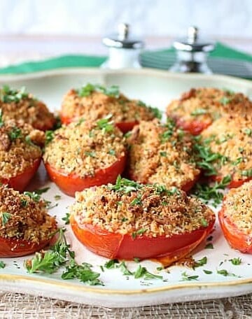 Plate of Italian Roasted Plum Tomatoes with breadcrumbs and cheese.