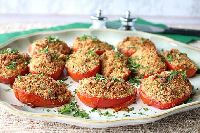Plate of Italian Roasted Plum Tomatoes with breadcrumbs and cheese.