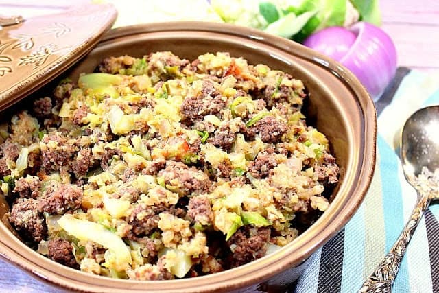 An offset photo of a low-carb cabbage roll casserole using cauliflower rice in a round tan baking dish