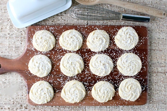 Overhead photo of a wooden tray filled with Viennese Whirls Butter Cookies.