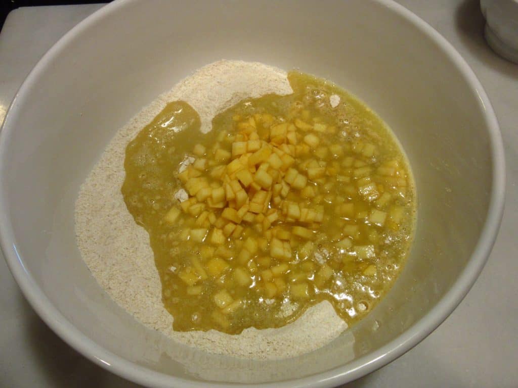 The ingredients in a bowl for making Apple Cider Donut Muffins.