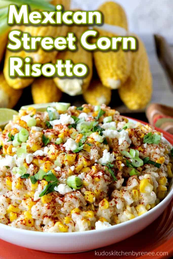 A closeup photo of Mexican street corn risotto in a bowl with cheese and green onions as garnish.