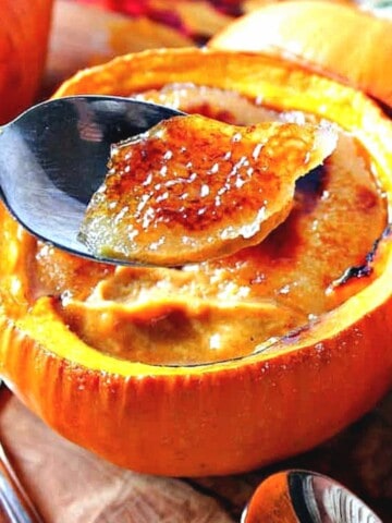 Pumpkin Creme Brulee served in a real pie pumpkin with a crunchy sugar topping.