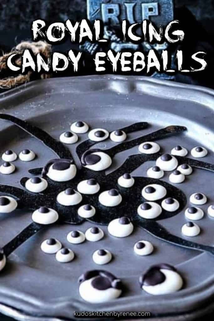 Vertical title text image of royal icing candy eyeballs on a spooky gray plate with a spider silhouette.