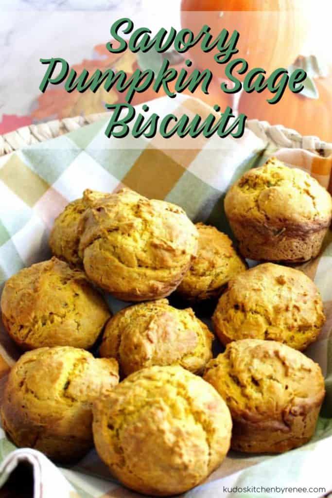Vertical title text closeup image of a basket full of pumpkin sage biscuits.