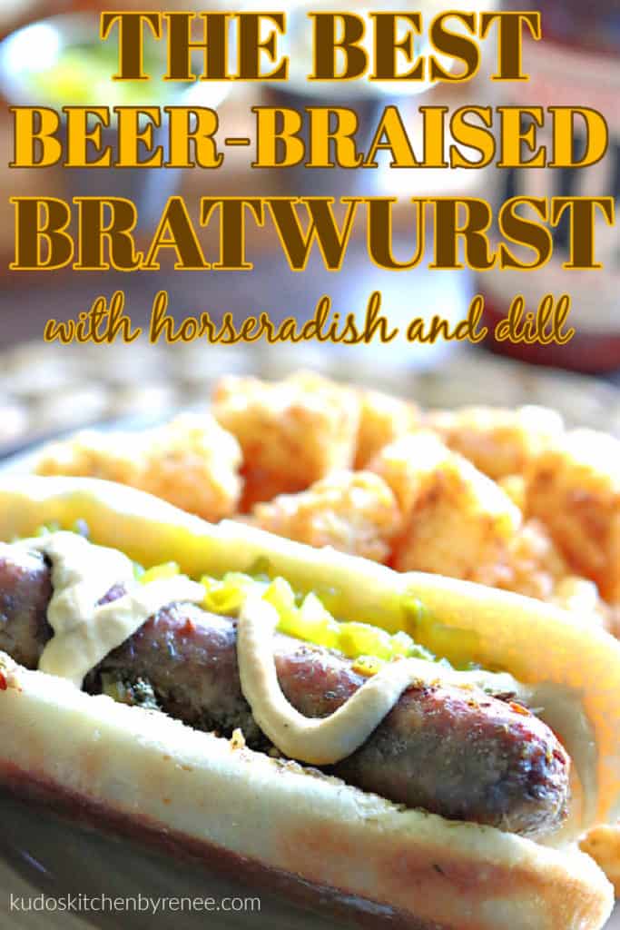A closeup photo of a beer-braised bratwurst with mustard and tater tots on a plate with title text overlay graphic