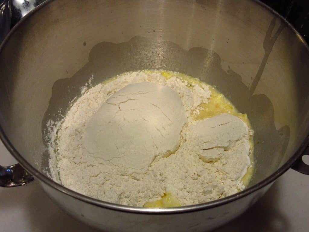 Flour in a mixing bowl with liquid ingredients.
