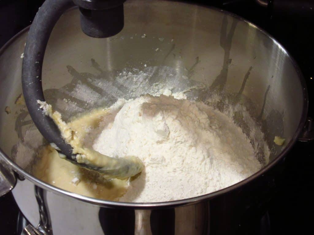 Flour in the bowl of a stand mixer.