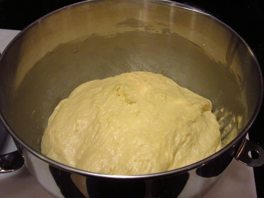 Proofed dough in a mixing bowl.