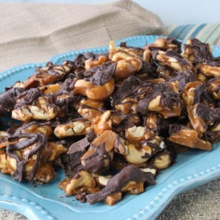 Butter Toffee Cashew Crunch Candy on a blue platter