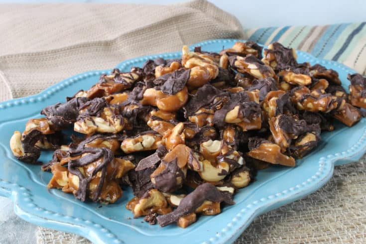 Butter Toffee Cashew Crunch Candy on a blue platter