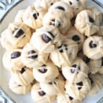 A stack of Irish Cream Butter Cookies with Irish cream Glaze and a chocolate espresso bean on top.