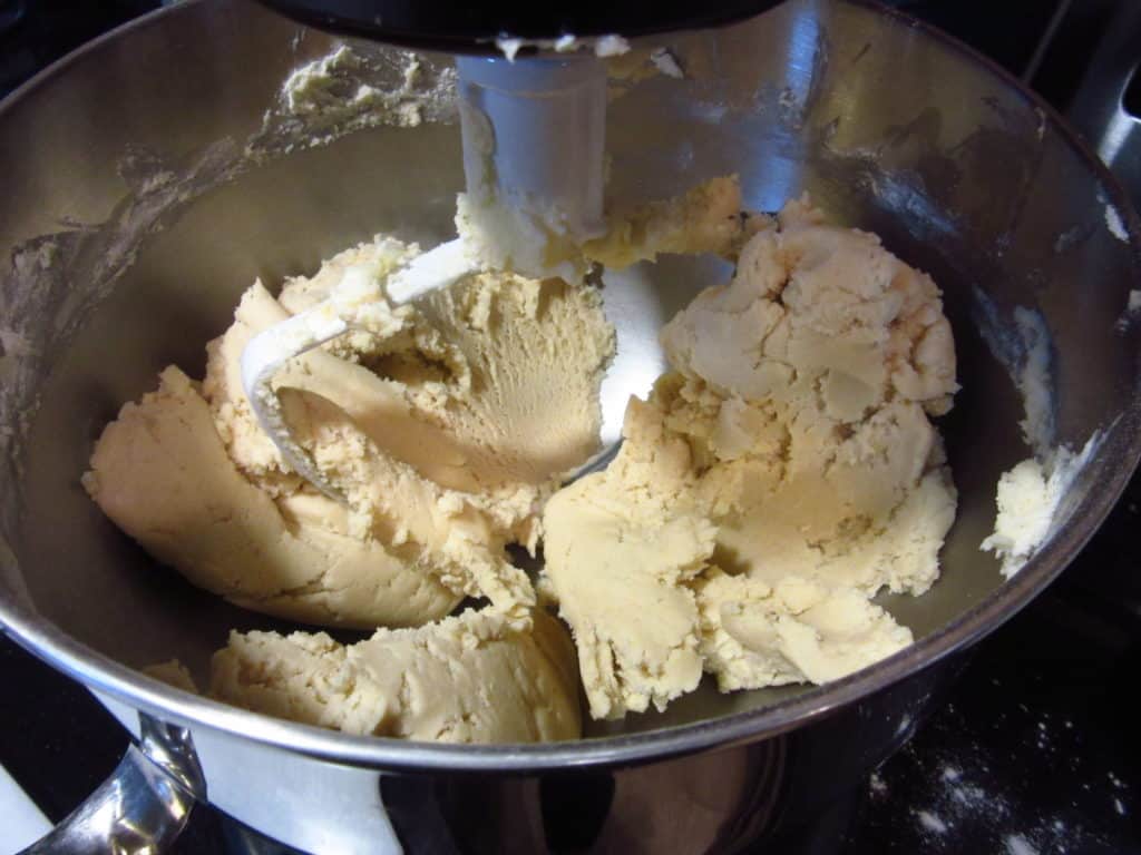 Cookie dough in a stand mixer.