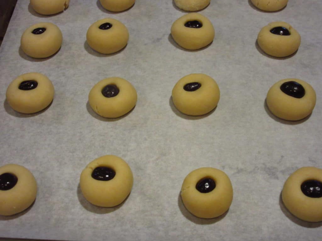 Unbaked cookies on a baking sheet.