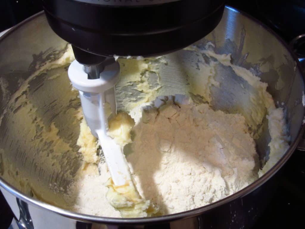 Flour in a stand mixer making cookie dough.