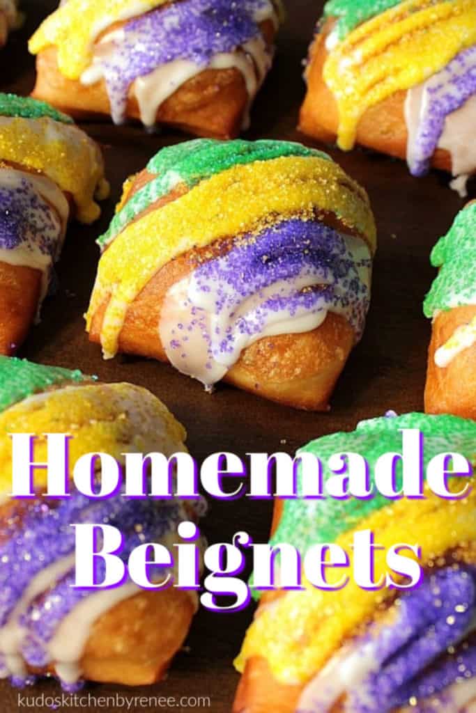 Closeup vertical title text image of fried beignets with purple, green, and gold sugar for Mardi gras.