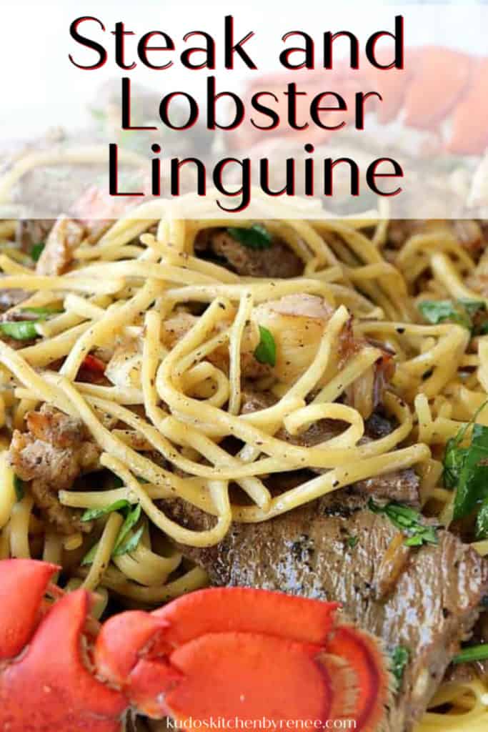 A closeup vertical image of steak and lobster linguine with parsley, lobster tails, and title text overlay graphic.