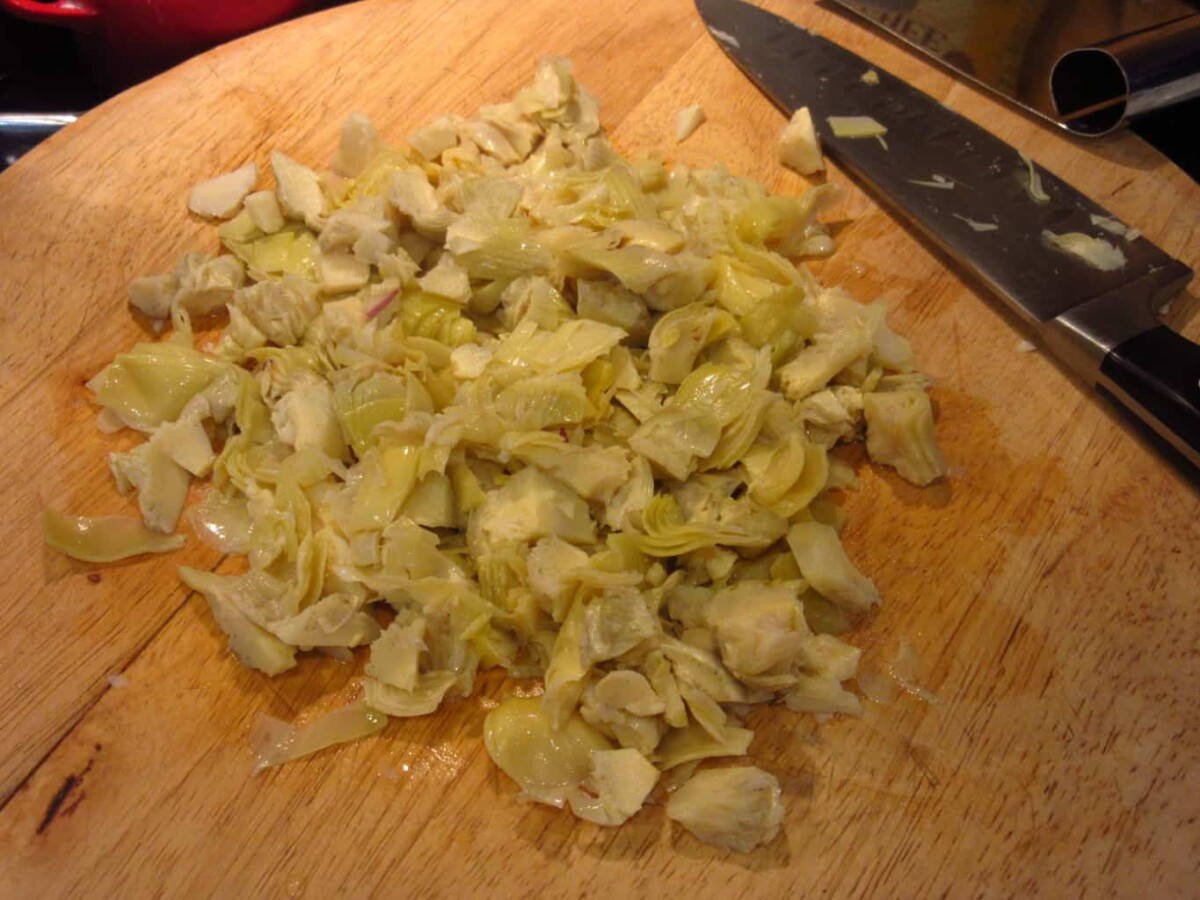 Chopped artichoke on a cutting board.