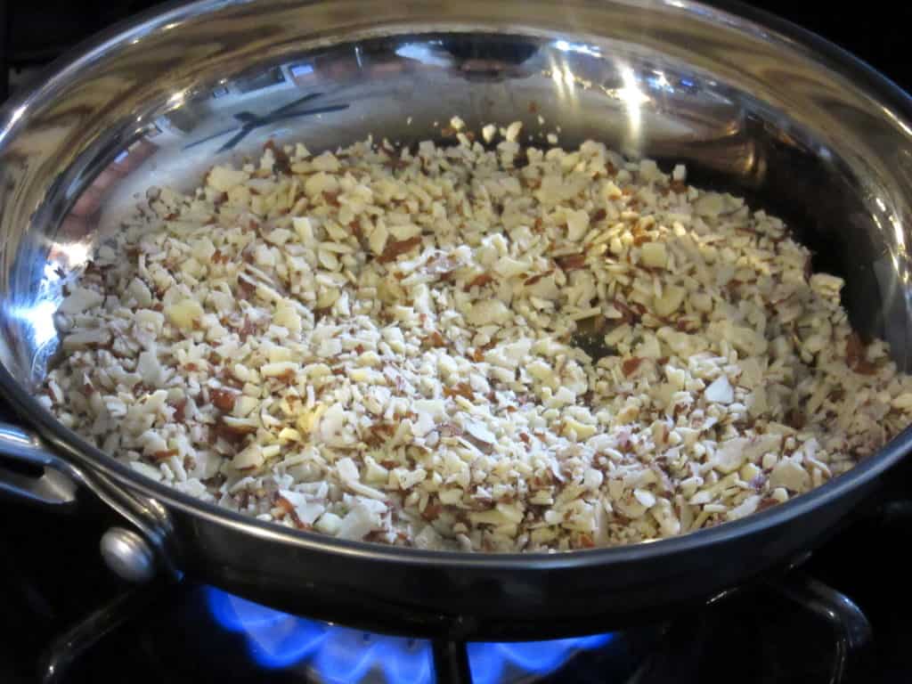 Toasted nuts in a skillet.