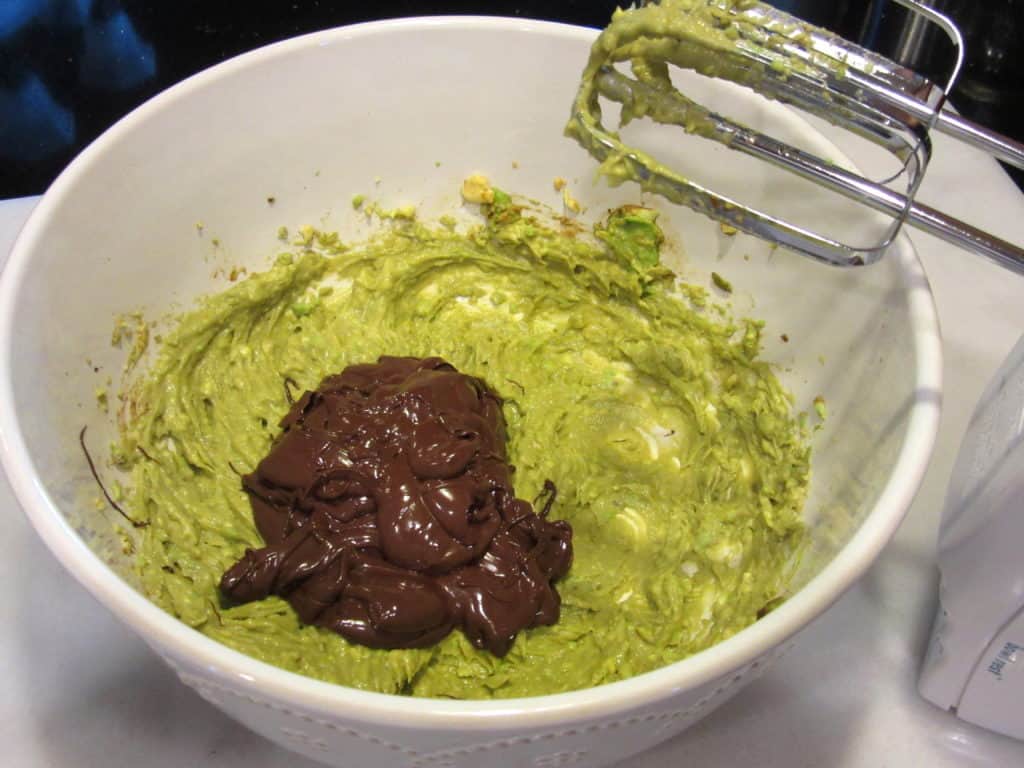 Avocado and chocolate in a white bowl.