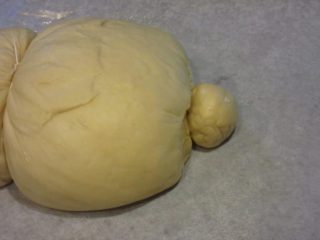 Small piece of dough to form the tail of bunny bread. 