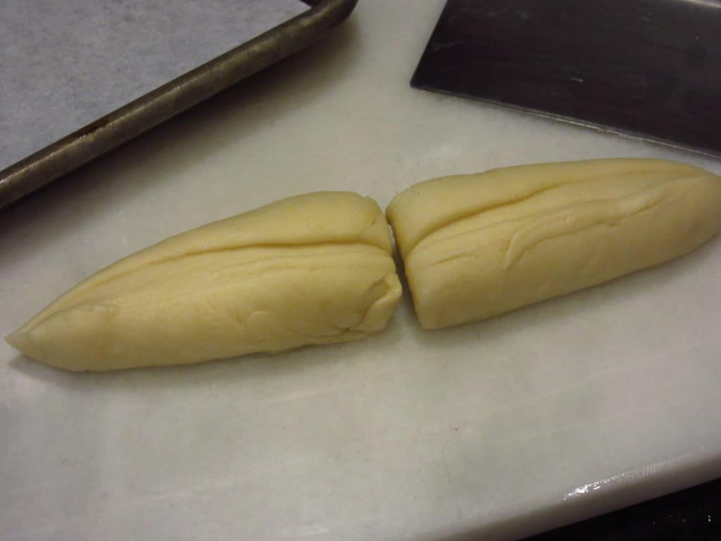 Two pieces of dough for the ears of bunny bread.