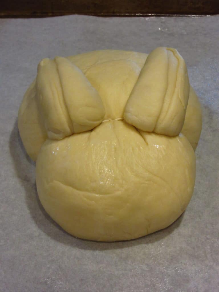 Unbaked bunny bread on the counter.