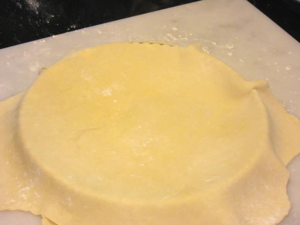 A tart dough that was transferred to a tart pan.