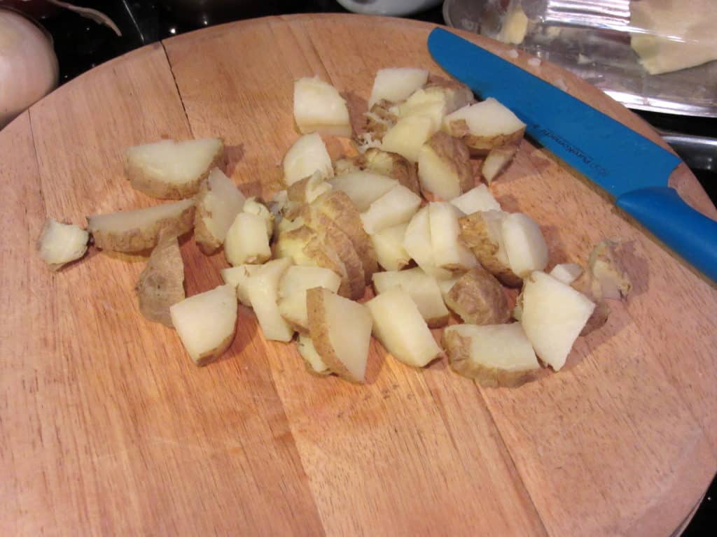 Cooked and cut cooked potatoes.